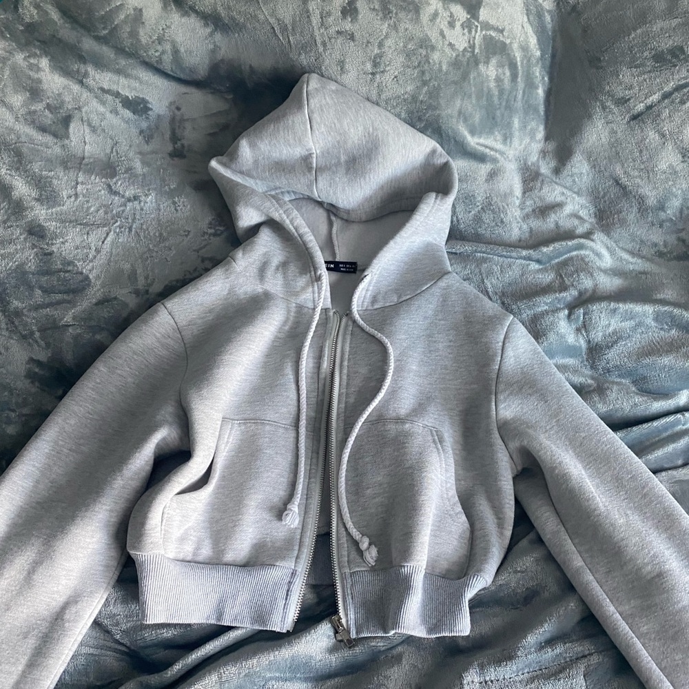 Crop grey hoodie with pockets and hood super soft and comfy wore once or twice.